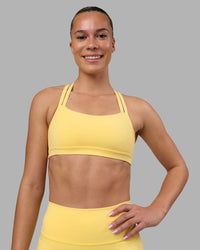 Woman wearing Velocity Sports Bra - Lemon | Model:Charlize | Size:S | Thumbnail Index: 0