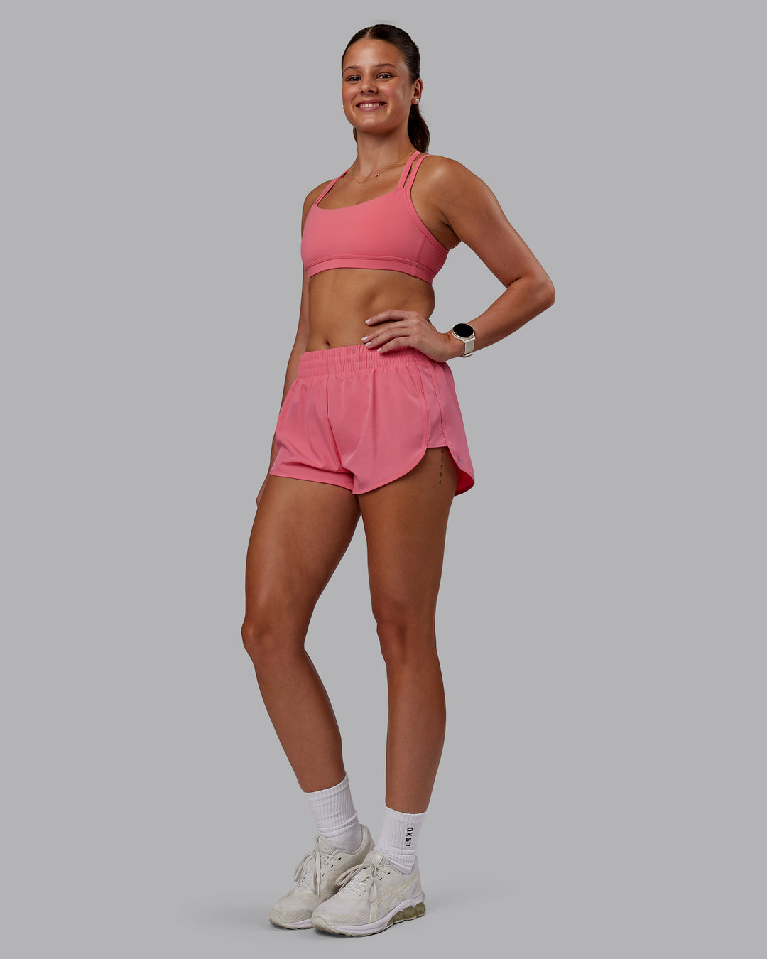 Woman wearing Velocity Sports Bra -- Pink Lemonade | Model:Phoebe | Size:S - view 3