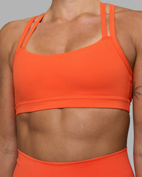 Woman wearing Velocity Sports Bra - Ultra Orange | Model:Katie | Size:S | Thumbnail Index: 3
