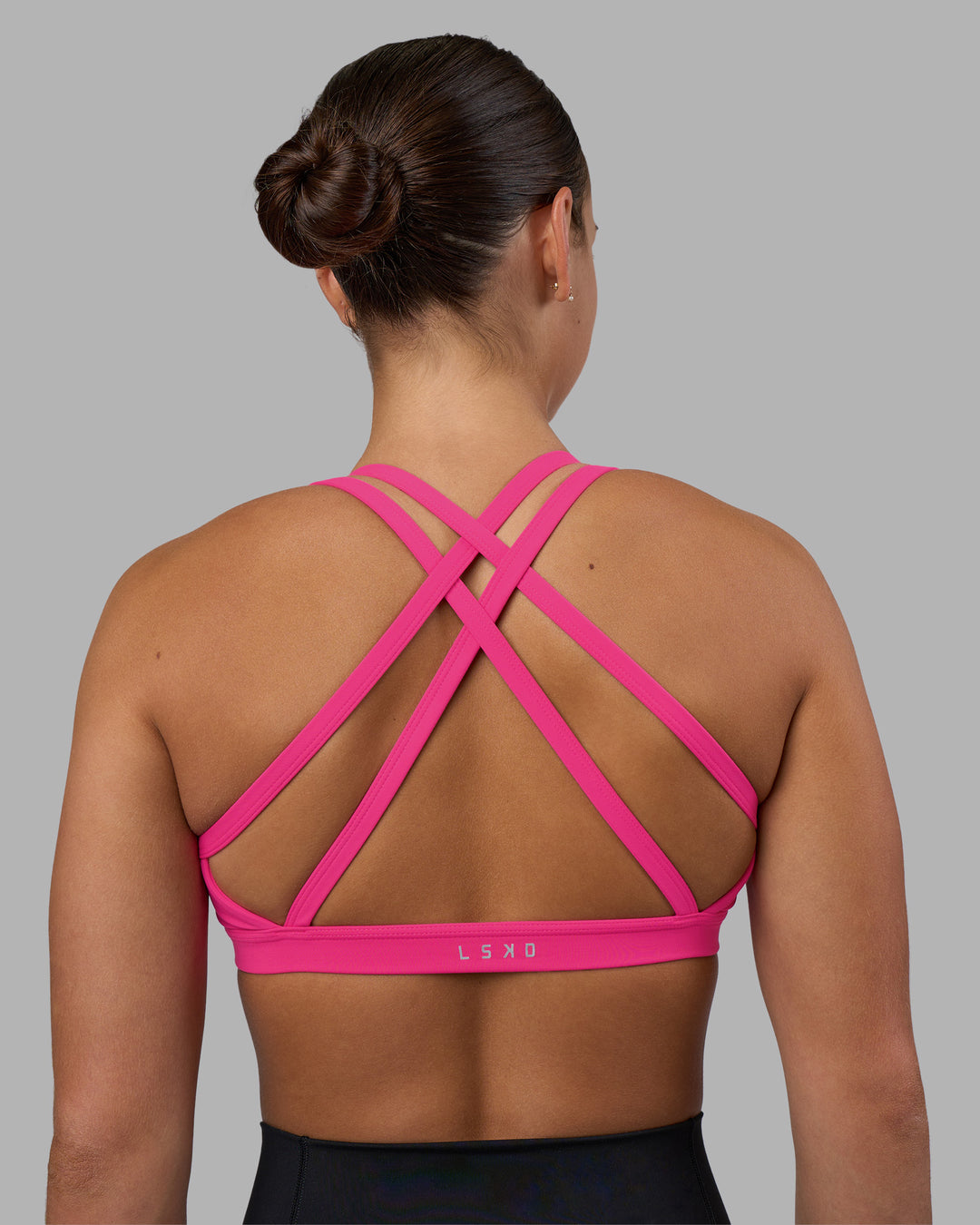 Woman wearing Velocity Sports Bra - Ultra Pink | Model:Keisha | Size:S - view 7