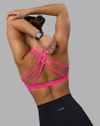 Woman wearing Velocity Sports Bra - Ultra Pink | Model:Keisha | Size:S | Thumbnail Index: 0