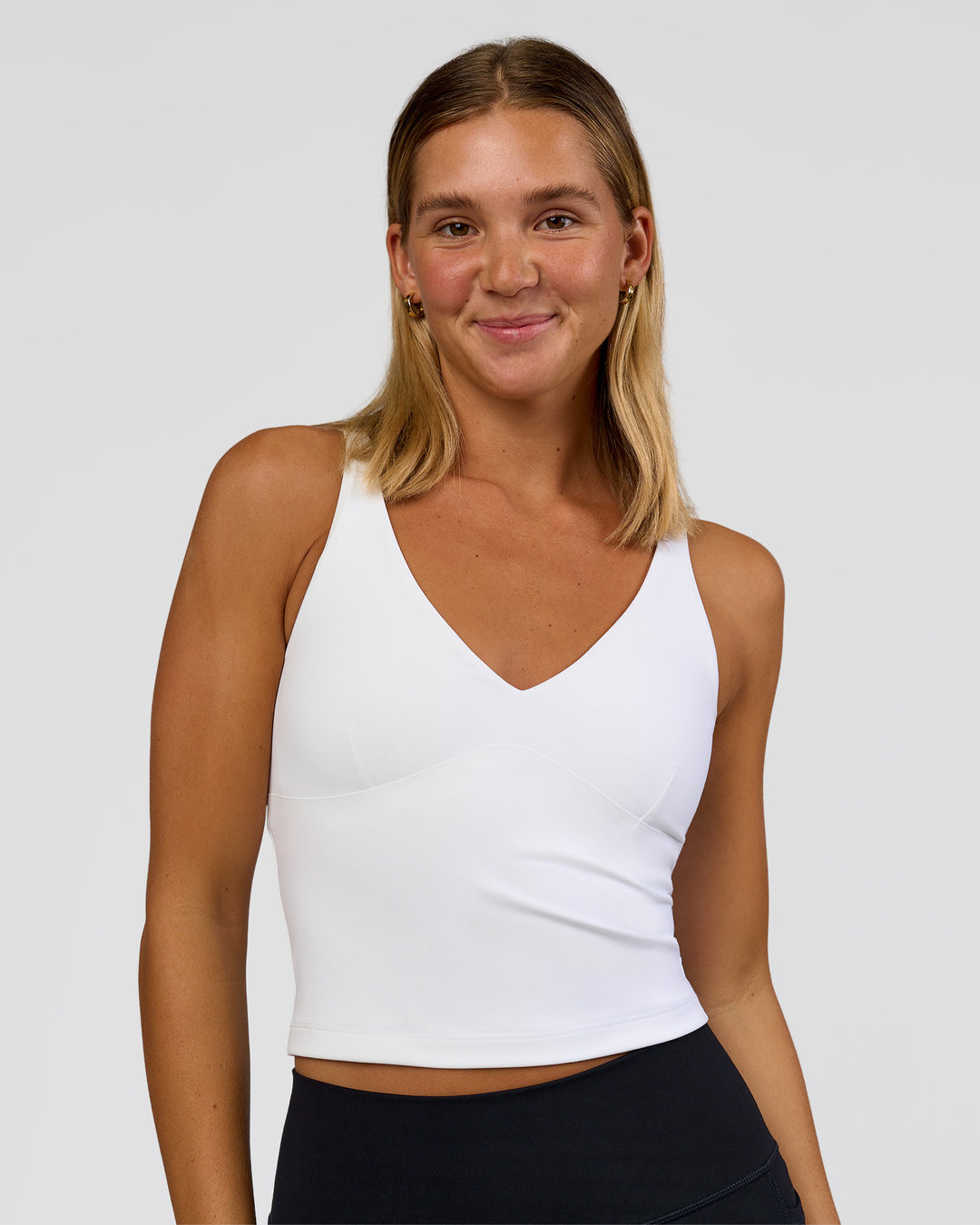 Woman wearing Vitality Active Tank - White | Model:Amity | Size:S - view 1