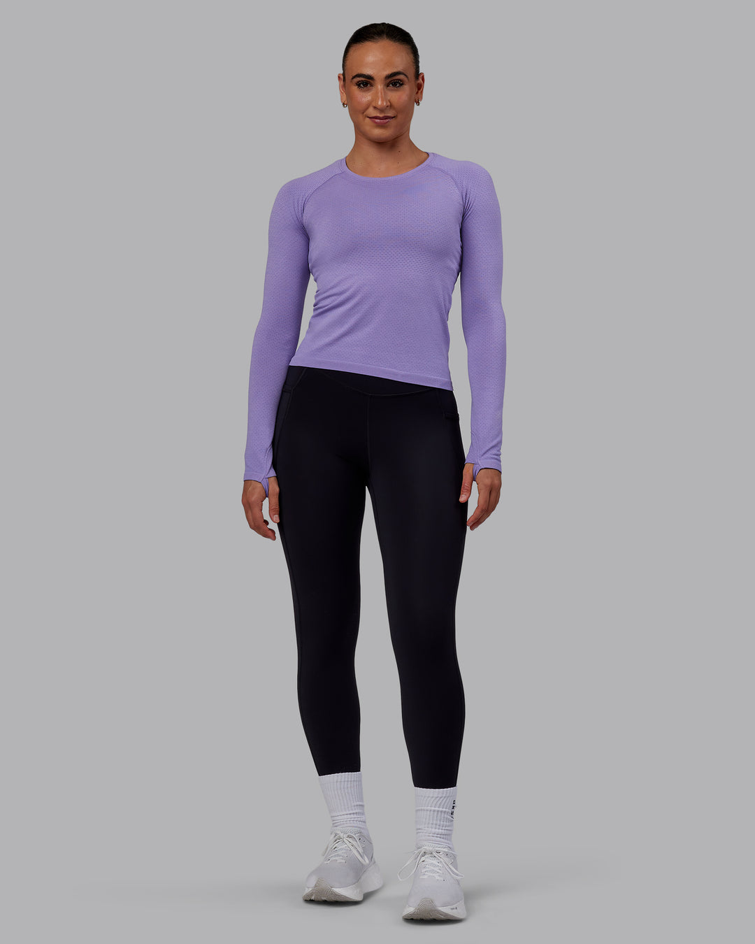 Woman wearing AeroFLX+ Seamless Long Sleeve Tee - Dahlia Purple Marl - view 5