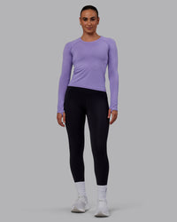 Woman wearing AeroFLX+ Seamless Long Sleeve Tee - Dahlia Purple Marl | Thumbnail Index: 4