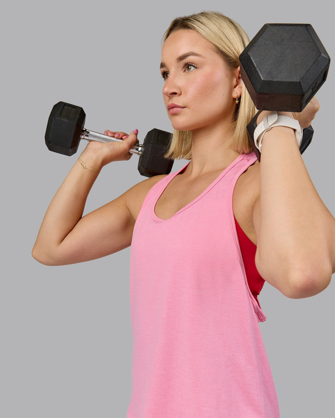 Woman wearing AeroFLX+ Drop Armhole Seamless Tank - Candy Pink | Model:Halle | Size:S - view 1