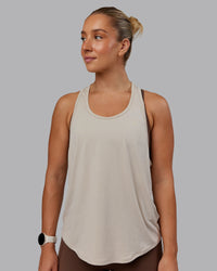 Woman wearing AeroFLX+ Drop Armhole Seamless Tank - Shale Beige | Model:Lyss | Size:S | Thumbnail Index: 8