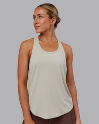Woman wearing AeroFLX+ Drop Armhole Seamless Tank - Shale Beige | Model:Paris | Size:S | Thumbnail Index: 6
