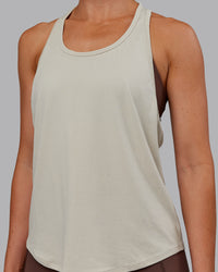 Woman wearing AeroFLX+ Drop Armhole Seamless Tank - Shale Beige | Model:Paris | Size:S | Thumbnail Index: 9