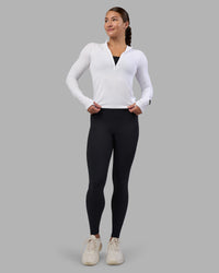 Woman wearing AeroFLX+ Long Sleeve Half Zip - White/White | Model:Hannah | Size:S | Thumbnail Index: 4