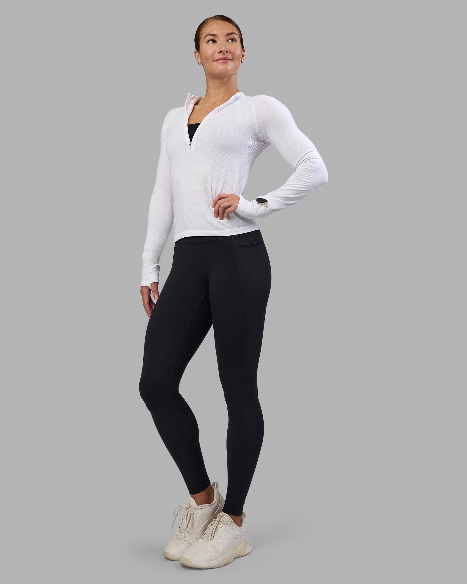 Woman wearing AeroFLX+ Long Sleeve Half Zip - White/White | Model:Hannah | Size:S