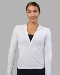 Woman wearing AeroFLX+ Long Sleeve Half Zip - White/White | Model:Hannah | Size:S | Thumbnail Index: 0