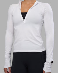 Woman wearing AeroFLX+ Long Sleeve Half Zip - White/White | Model:Hannah | Size:S | Thumbnail Index: 6