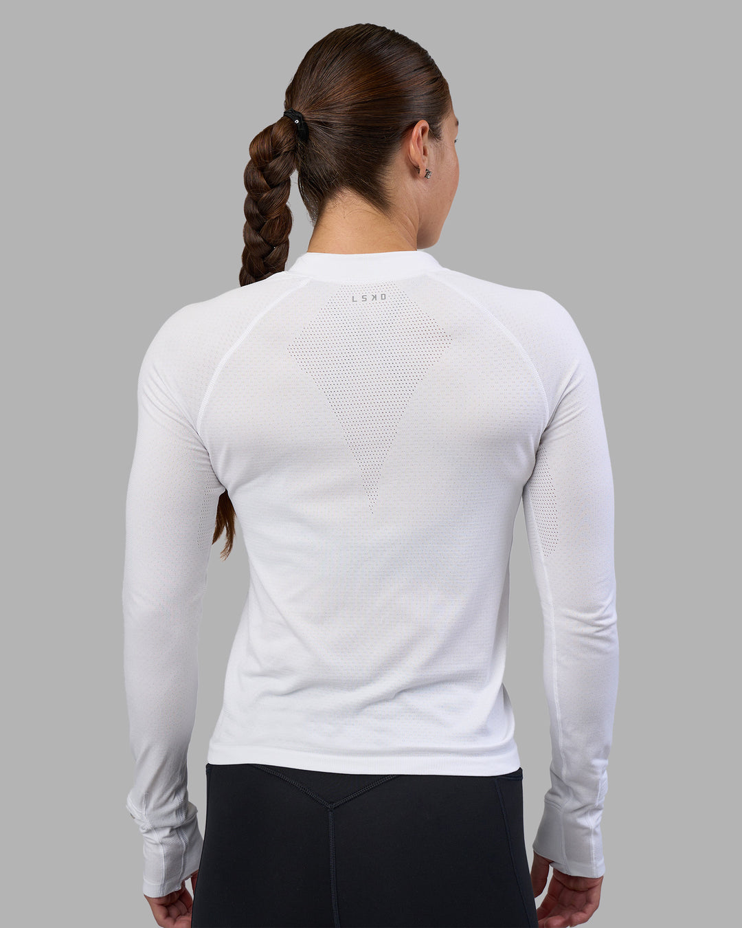 Woman wearing AeroFLX+ Long Sleeve Half Zip - White/White | Model:Hannah | Size:S - view 3