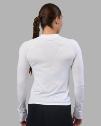 Woman wearing AeroFLX+ Long Sleeve Half Zip - White/White | Model:Hannah | Size:S | Thumbnail Index: 2