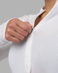 Woman wearing AeroFLX+ Long Sleeve Half Zip - White/White | Model:Hannah | Size:S | Thumbnail Index: 7