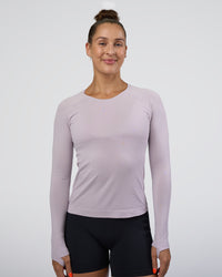 Woman wearing AeroFLX+ Seamless Long Sleeve Tee - Fair Orchid/Fair Orchid | Model:Abbey | Size:S | Thumbnail Index: 0