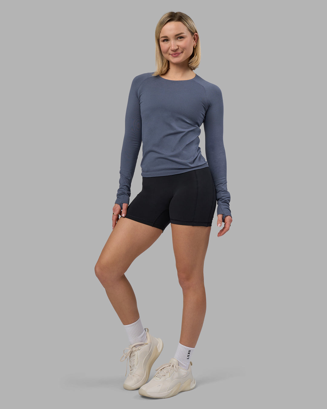 Woman wearing AeroFLX+ Seamless Long Sleeve Tee - Night Shadow/Night Shadow | Model:Halle | Size:S - view 1