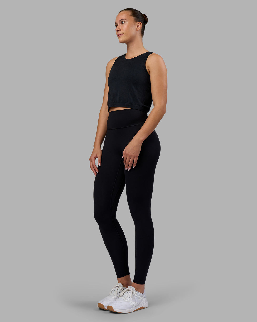 Woman wearing AeroFLX+ Seamless Skimmer Tank - Black Marl | Model:Charlize | Size:S - view 5