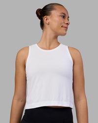 Woman wearing AeroFLX+ Seamless Skimmer Tank - White/White | Model:Charlize | Size:S | Thumbnail Index: 0