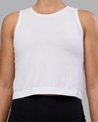 Woman wearing AeroFLX+ Seamless Skimmer Tank - White/White | Model:Charlize | Size:S | Thumbnail Index: 4
