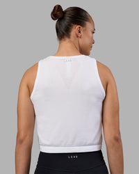 Woman wearing AeroFLX+ Seamless Skimmer Tank - White/White | Model:Charlize | Size:S | Thumbnail Index: 2