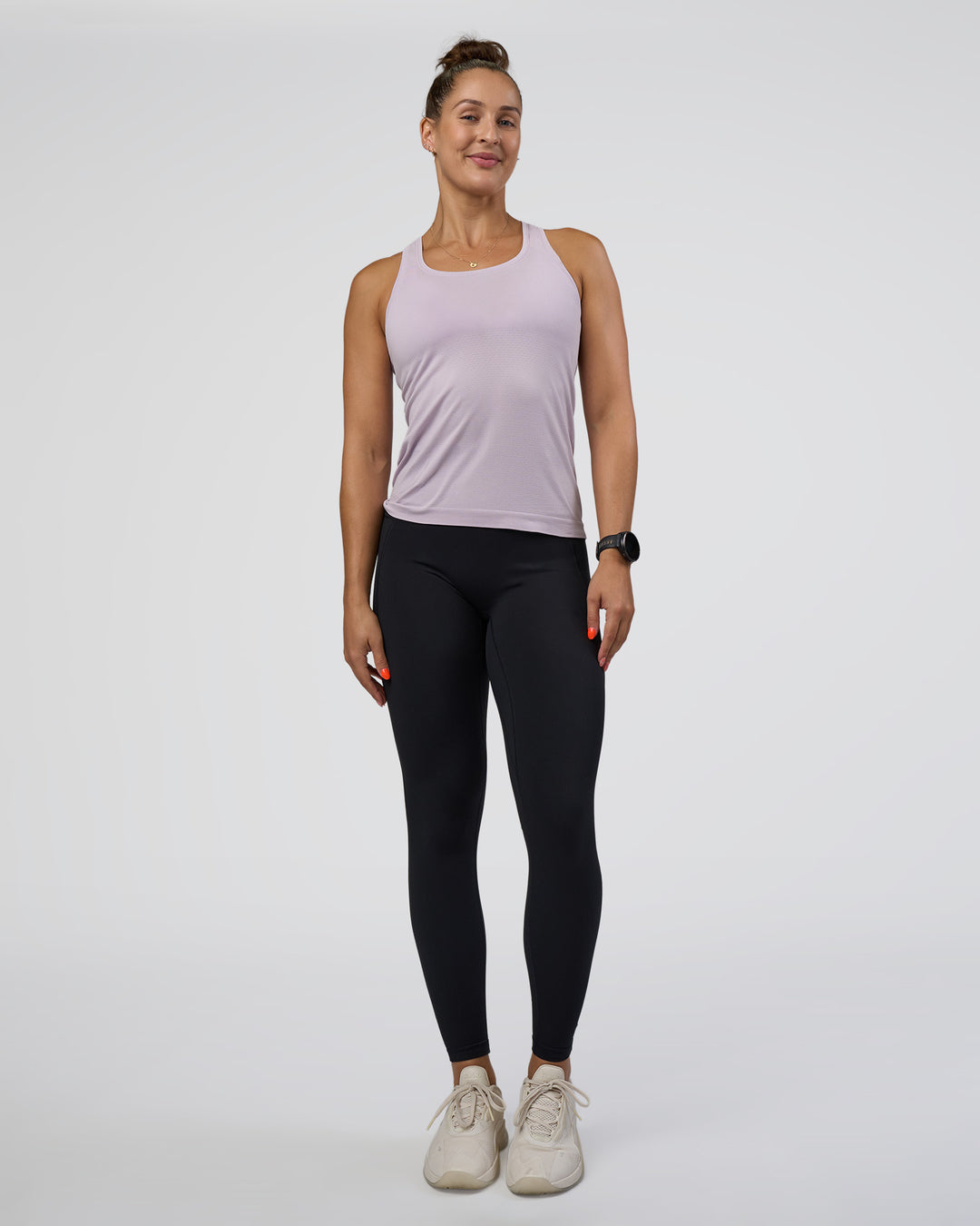 Woman wearing AeroFLX+ Seamless Tank - Fair Orchid/Fair Orchid | Model:Abbey | Size:S - view 5