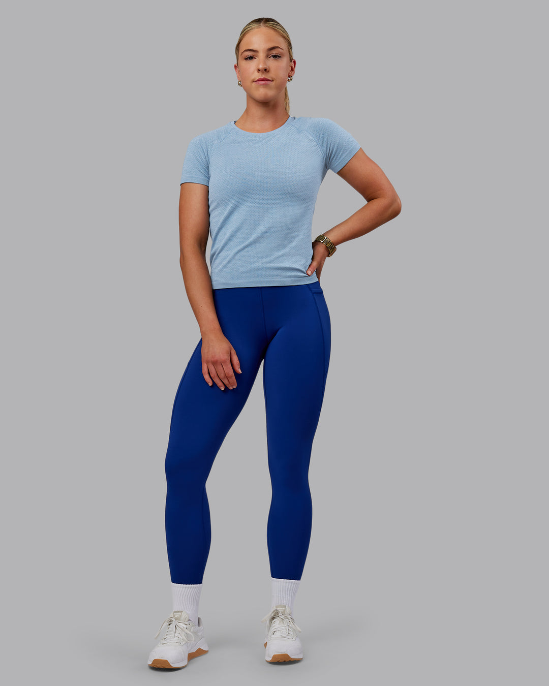 Woman wearing AeroFLX+ Seamless Tee - Elemental Blue/Ice Blue - view 6