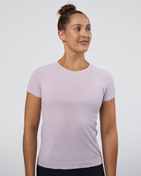 Woman wearing AeroFLX+ Seamless Tee - Fair Orchid/Fair Orchid | Model:Abbey | Size:S | Thumbnail Index: 1