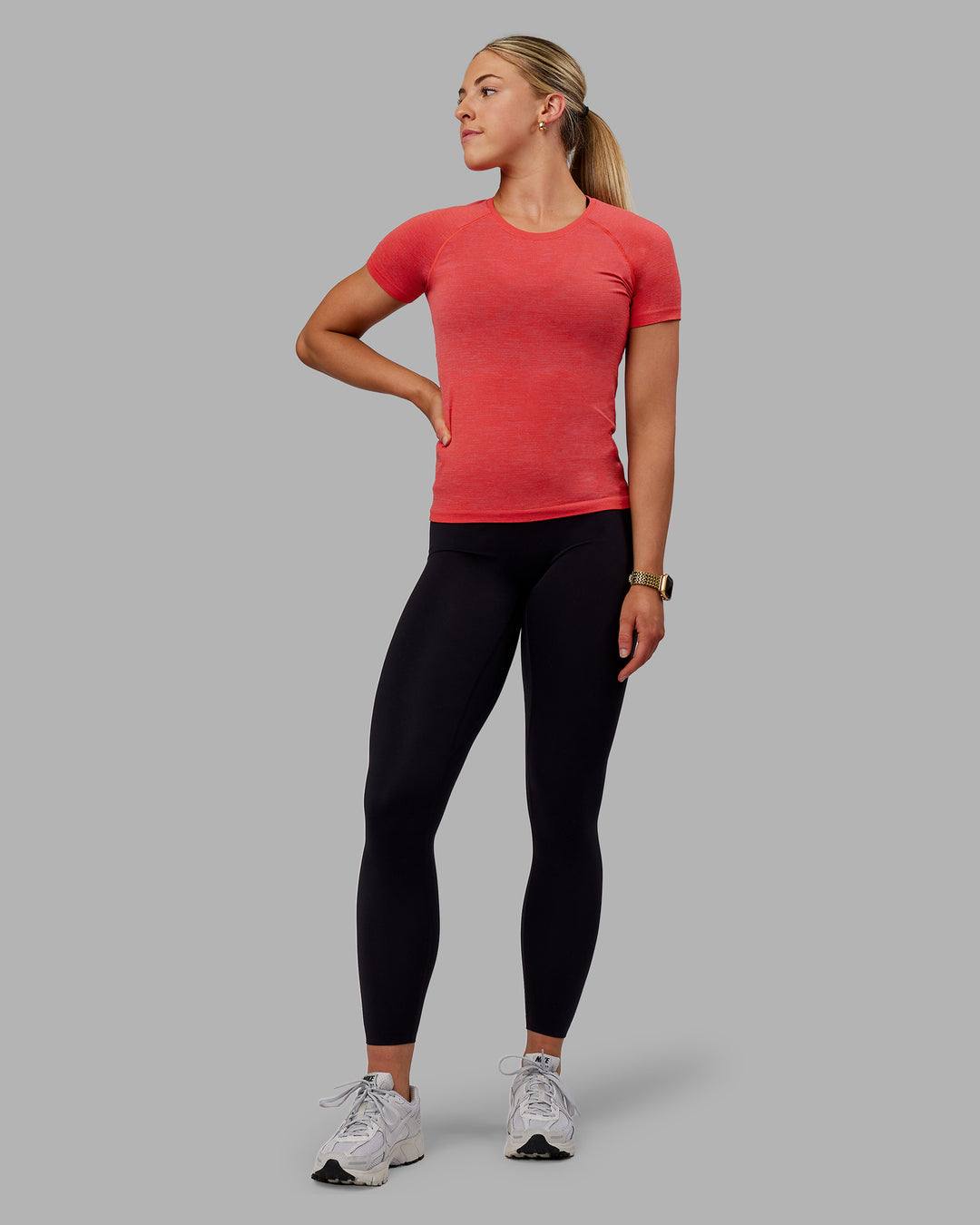 Woman wearing AeroFLX+ Seamless Tee - Fuchsia Pink/Grenadine - view 7