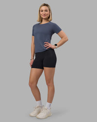 Woman wearing AeroFLX+ Seamless Tee - Night Shadow/Night Shadow | Model:Halle | Size:S | Thumbnail Index: 1
