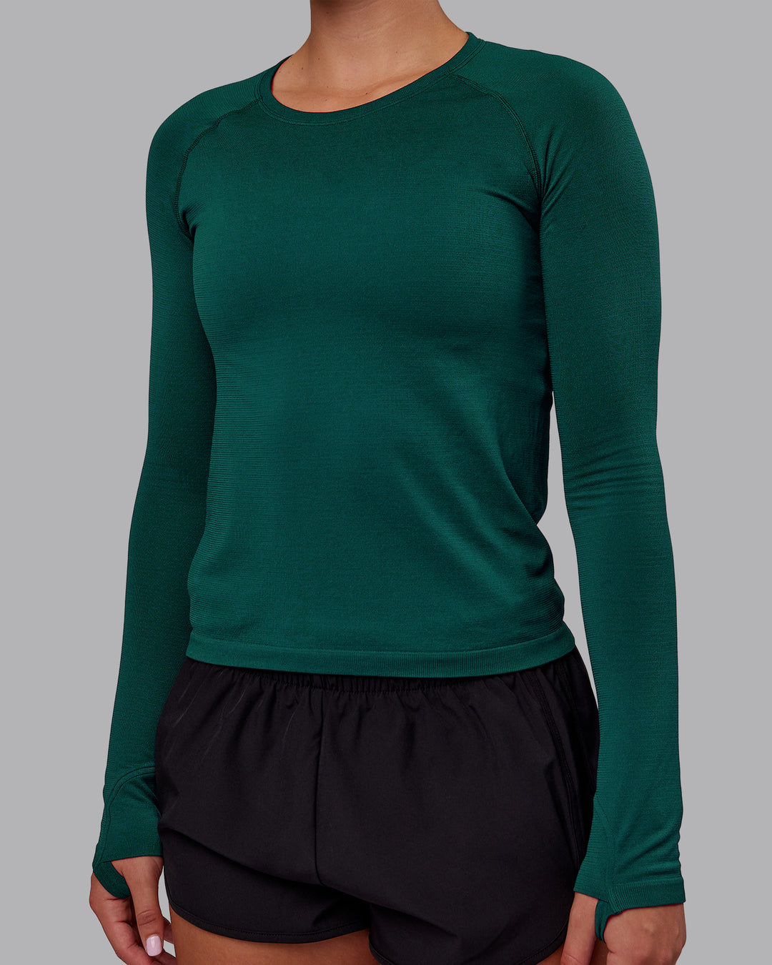 Woman wearing AeroFLX+ Seamless Long Sleeve Tee - Dark Moss/Dark Moss | Model:Charlize | Size:S - view 6