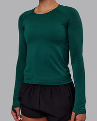Woman wearing AeroFLX+ Seamless Long Sleeve Tee - Dark Moss/Dark Moss | Model:Charlize | Size:S | Thumbnail Index: 5