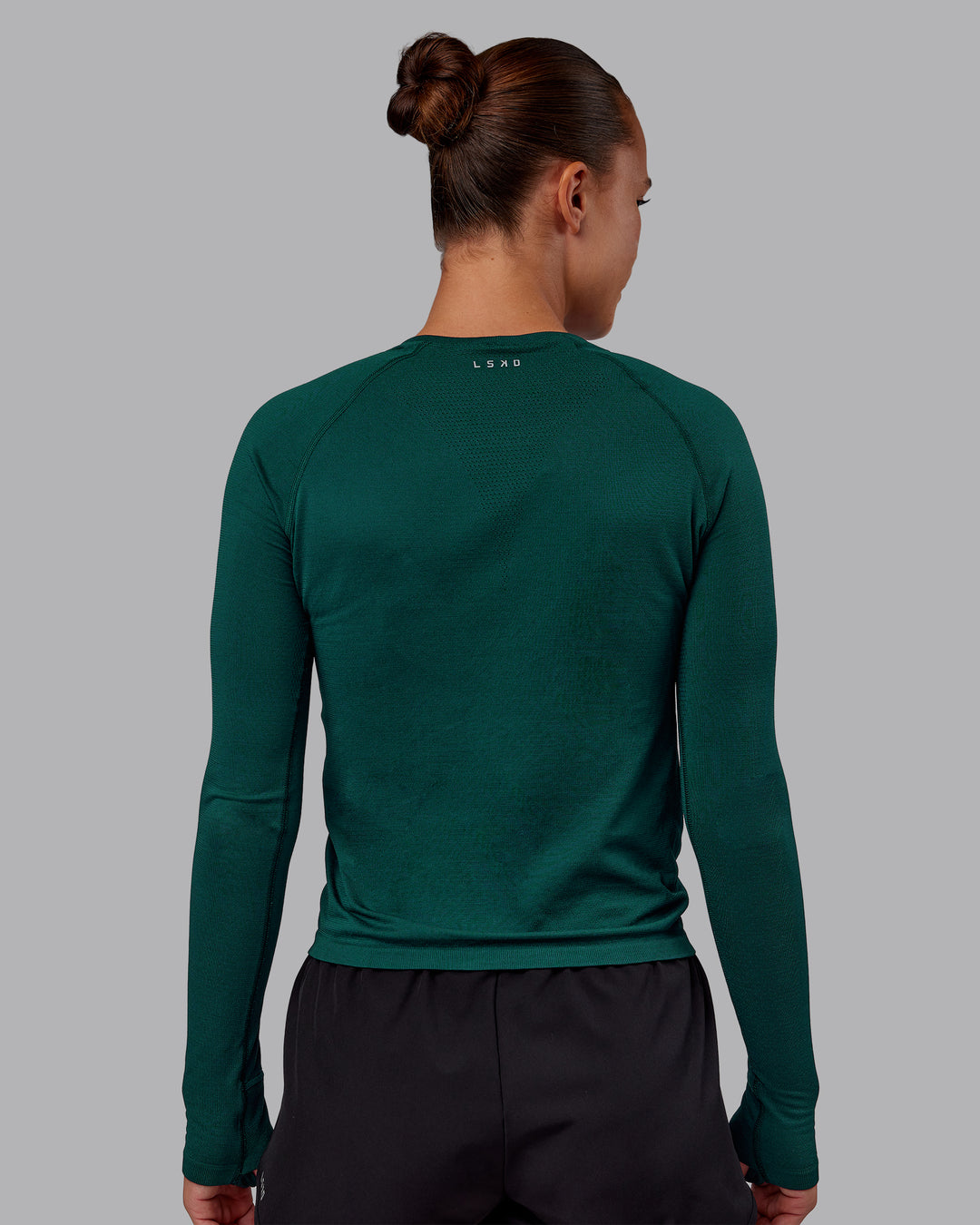 Woman wearing AeroFLX+ Seamless Long Sleeve Tee - Dark Moss/Dark Moss | Model:Charlize | Size:S - view 3