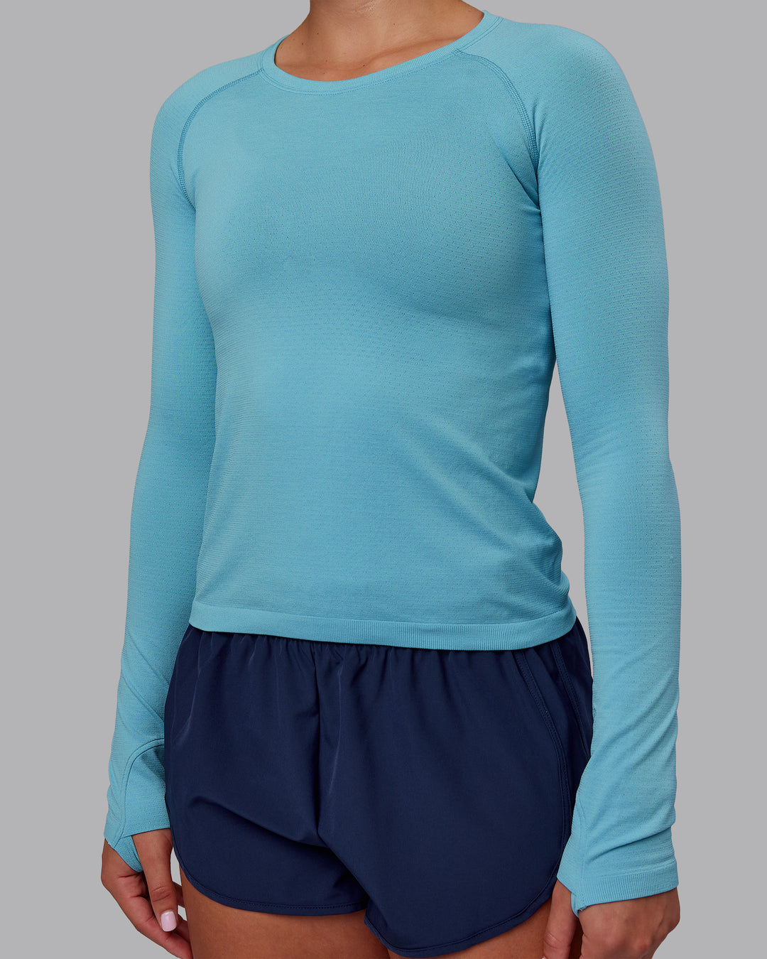 Woman wearing AeroFLX+ Seamless Long Sleeve Tee - Retro Blue/Retro Blue | Model:Charlize | Size:S - view 4