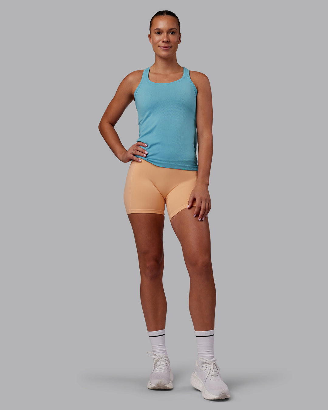 Woman wearing AeroFLX+ Seamless Tank - Retro Blue/Retro Blue | Model:Charlize | Size:S - view 7