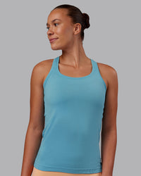 Woman wearing AeroFLX+ Seamless Tank - Retro Blue/Retro Blue | Model:Charlize | Size:S | Thumbnail Index: 0