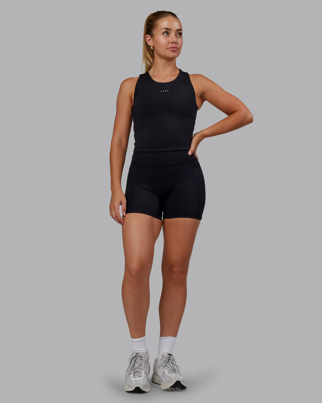 Woman wearing Base Tank - Black | Size:S | Model:Hannah - view 2