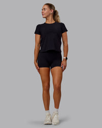 Woman wearing Cadence Tee - Black | Thumbnail Index: 4