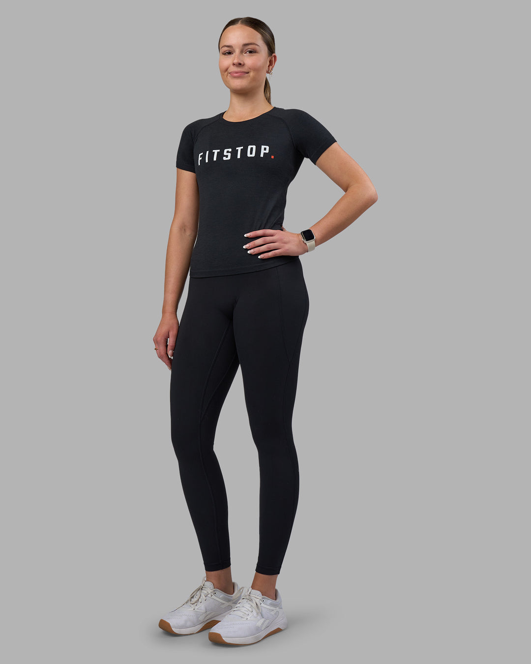 Woman wearing Fitstop AeroFLX+ Seamless Tee - Black | Model:Jade | Size:S - view 2