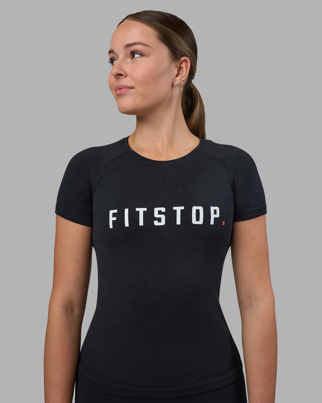Woman wearing Fitstop AeroFLX+ Seamless Tee - Black | Model:Jade | Size:S - view 1