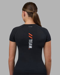 Woman wearing Fitstop AeroFLX+ Seamless Tee - Black | Model:Jade | Size:S | Thumbnail Index: 2