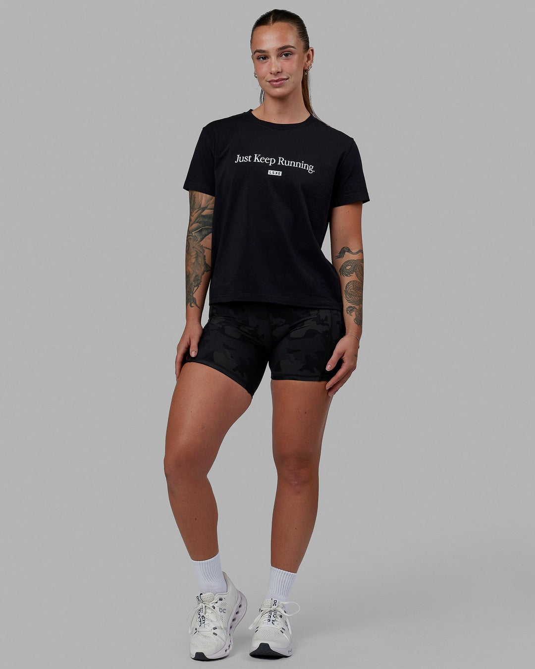 Woman wearing Just Keep Running FLXCotton Tee - Black-White - view 5