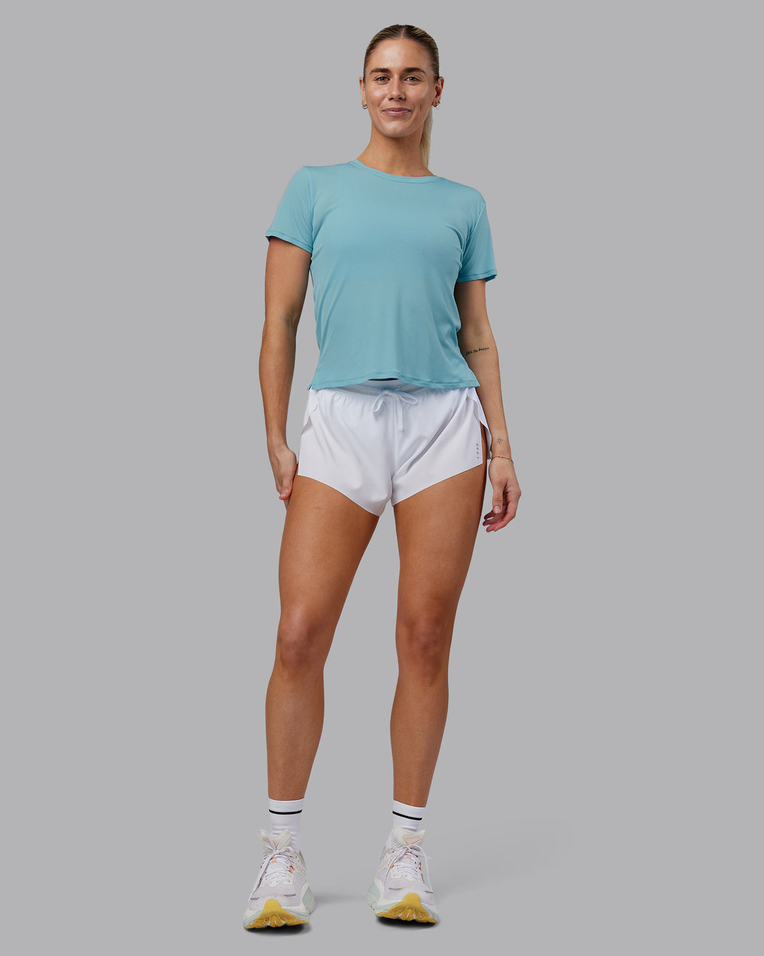 Woman wearing Pace Running Tee - Retro Blue | Model:Hannah | Size:S - view 1