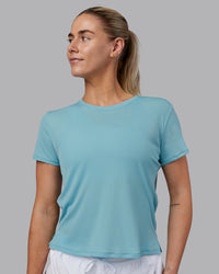 Woman wearing Pace Running Tee - Retro Blue | Model:Hannah | Size:S | Thumbnail Index: 1