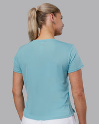 Woman wearing Pace Running Tee - Retro Blue | Model:Hannah | Size:S | Thumbnail Index: 2