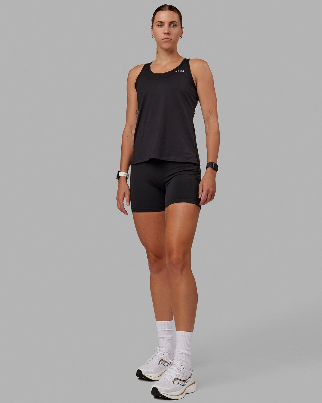 Woman wearing Perform VapourFLX Tank - Black - view 6