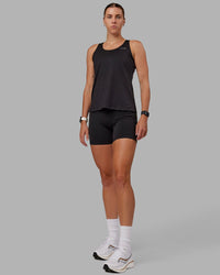 Woman wearing Perform VapourFLX Tank - Black | Thumbnail Index: 5