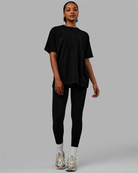 Woman wearing Stamped Heavyweight Oversized Tee - Black | Thumbnail Index: 4