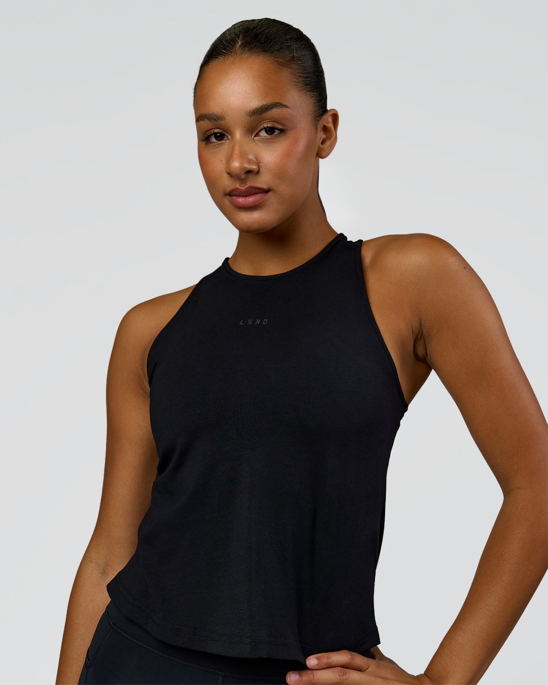 Woman wearing Wrap It Up FLXCotton Tank - Black | Model:Rosie | Size:S - view 1
