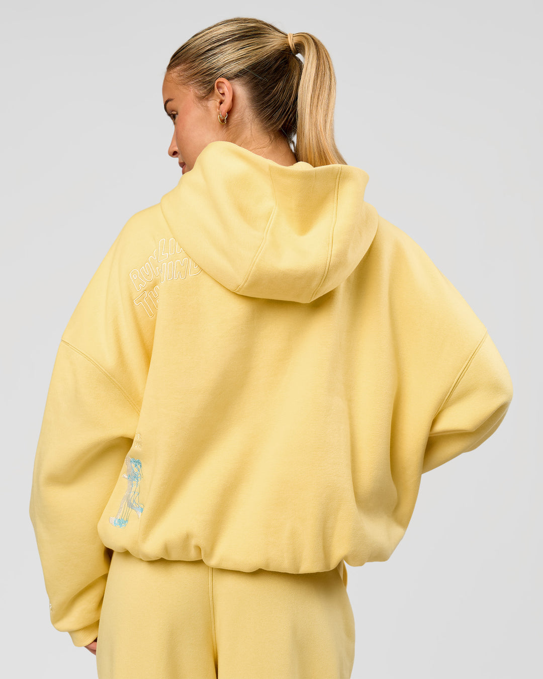 Woman wearing Zola Oversized Hoodie - Lemon | Model:Issy | Size:S - view 19